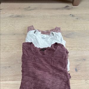 Stack of Burgundy and Gray Sweaters